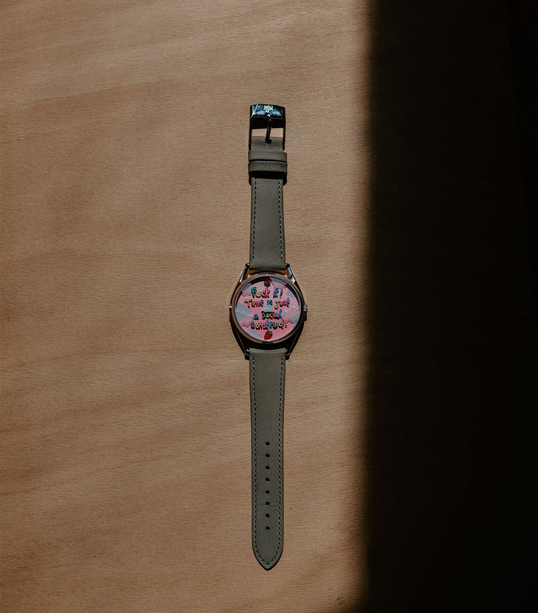 Berry Late Again! watch on wooden background