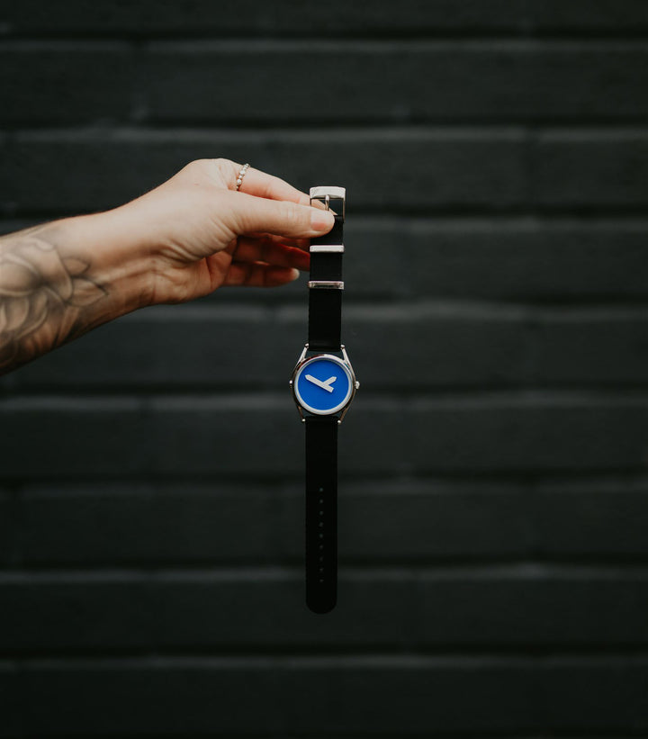M1 watch against a wall
