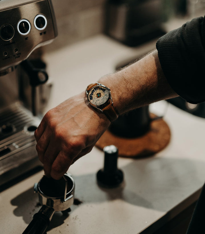 Nuage watch worn while making a coffee
