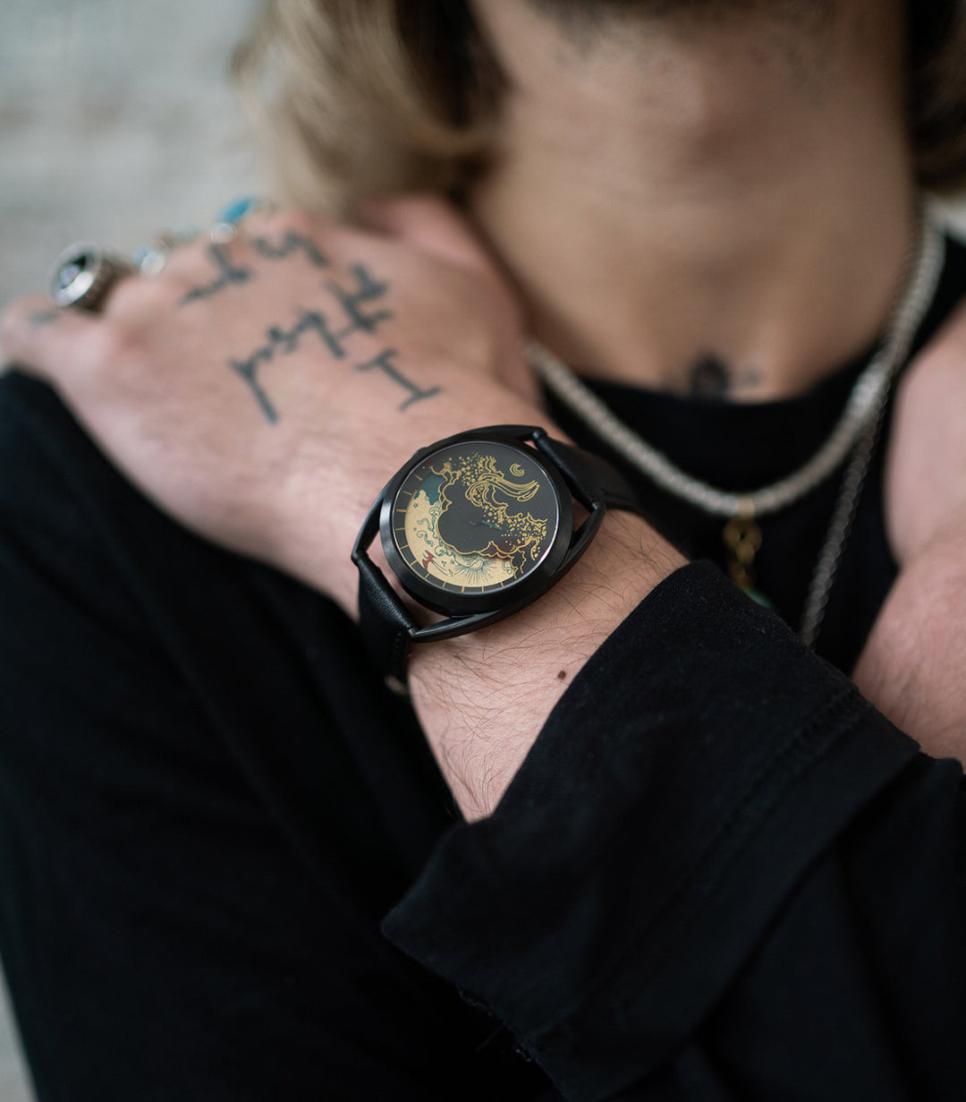 Paper crane watch on wrist