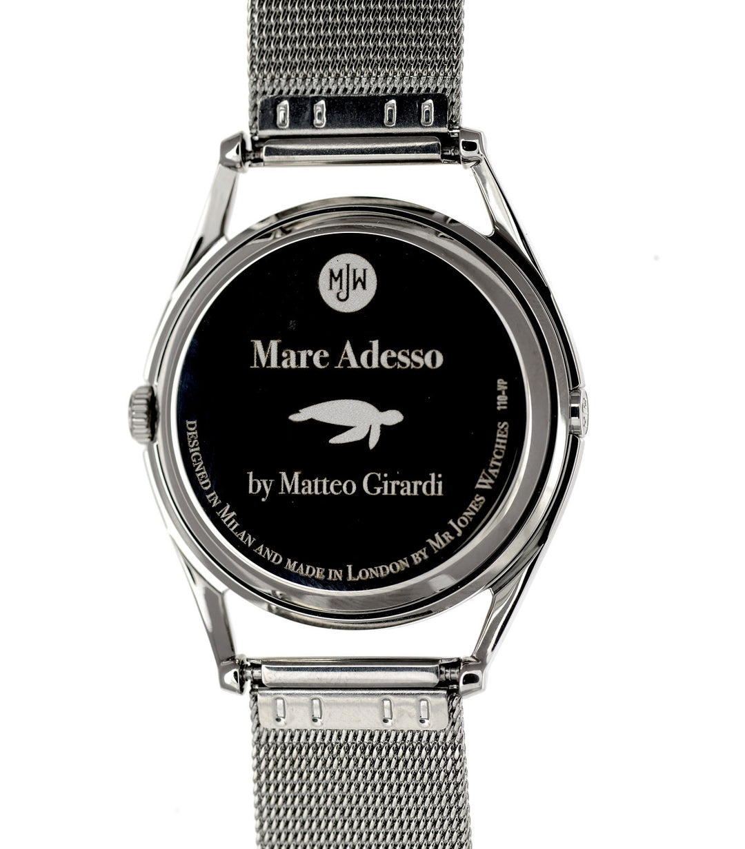 Mare Adesso watch caseback on white background