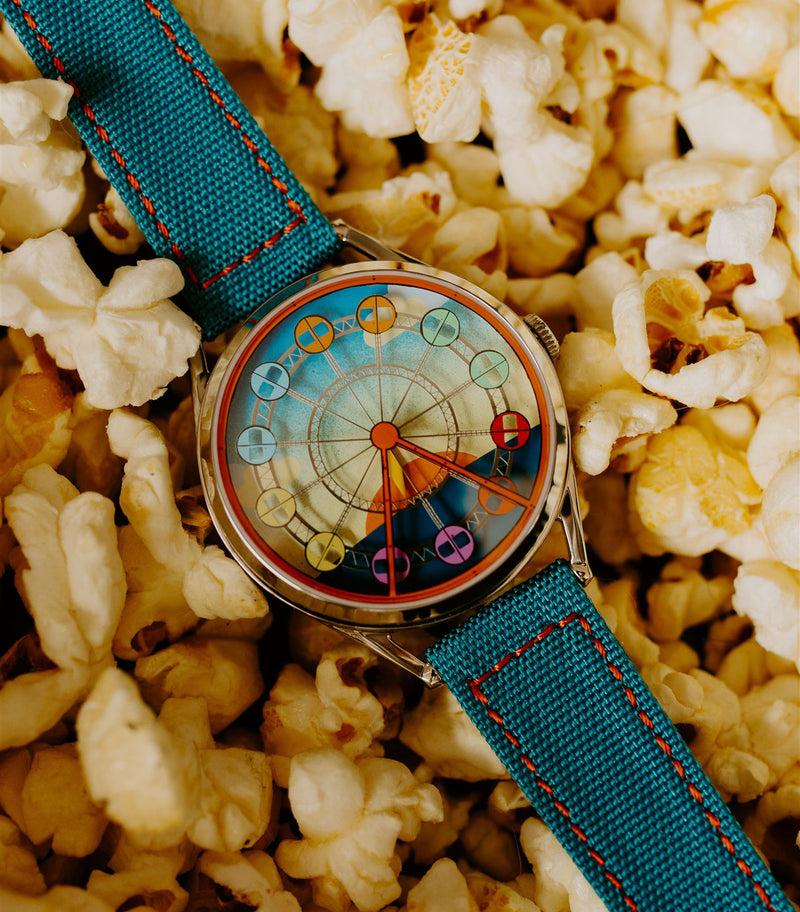 Enjoy the ride watch with popcorn background