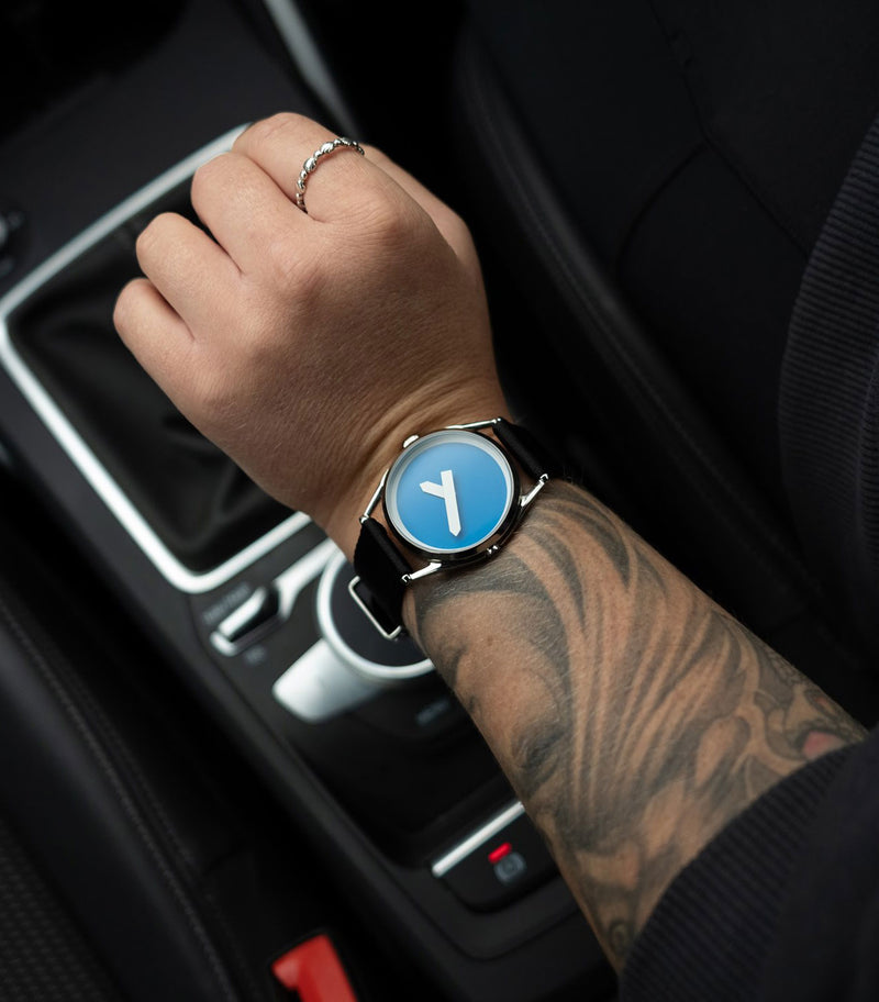 M1 watch worn in a car