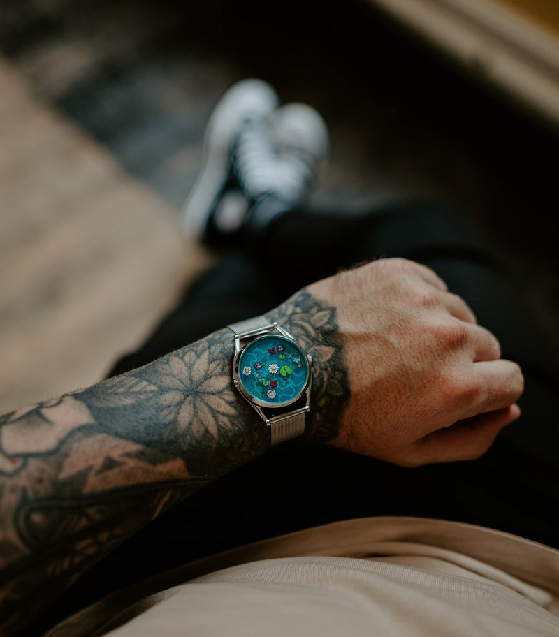 Ophelia watch worn on tattooed wrist