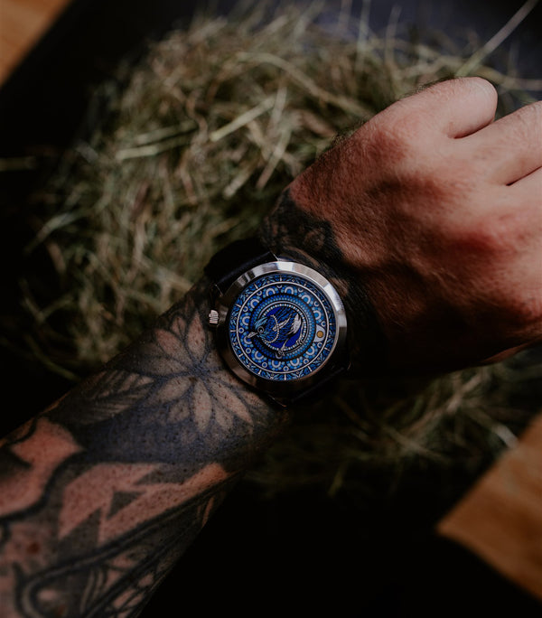 The Silent Thief watch worn on tattooed wrist