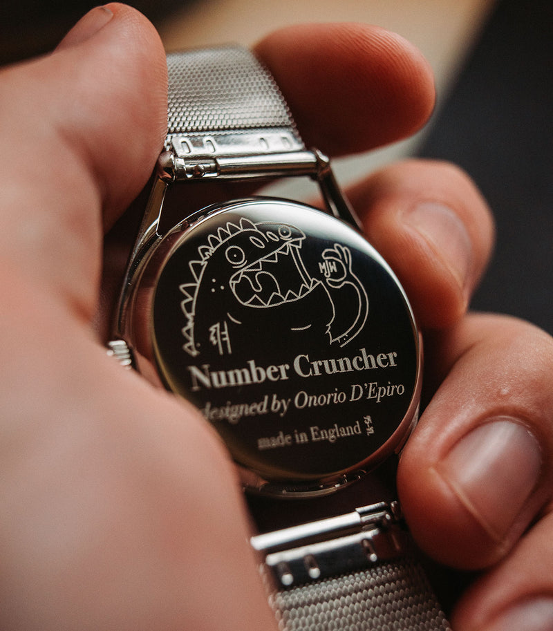 Number Cruncher watch caseback in hand