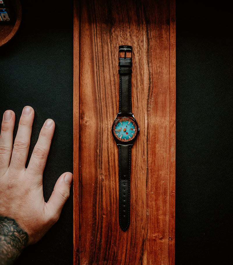 A Perfectly Useless Morning watch on wooden background