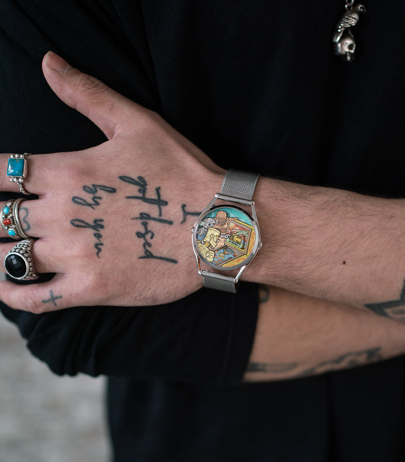 Ricochet watch worn on tattooed wrist