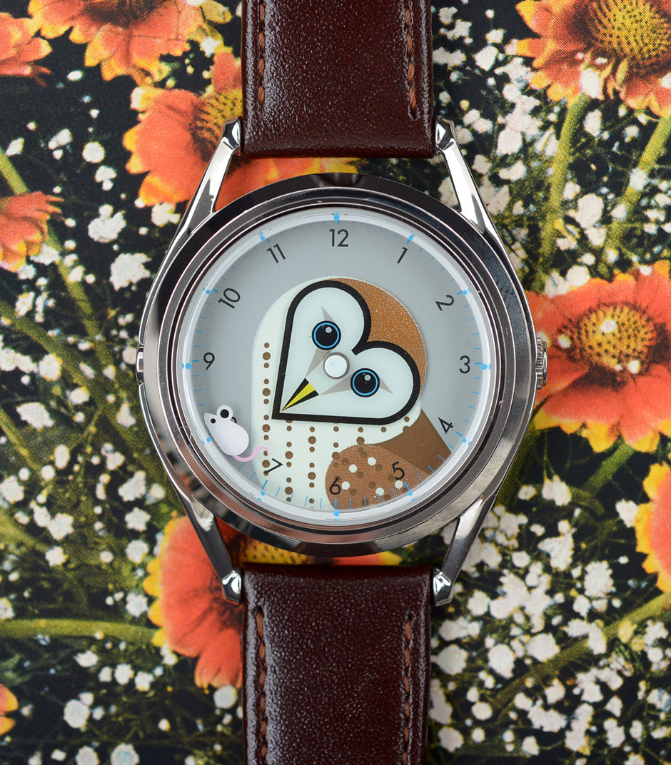 Timewise owl watch on floral background